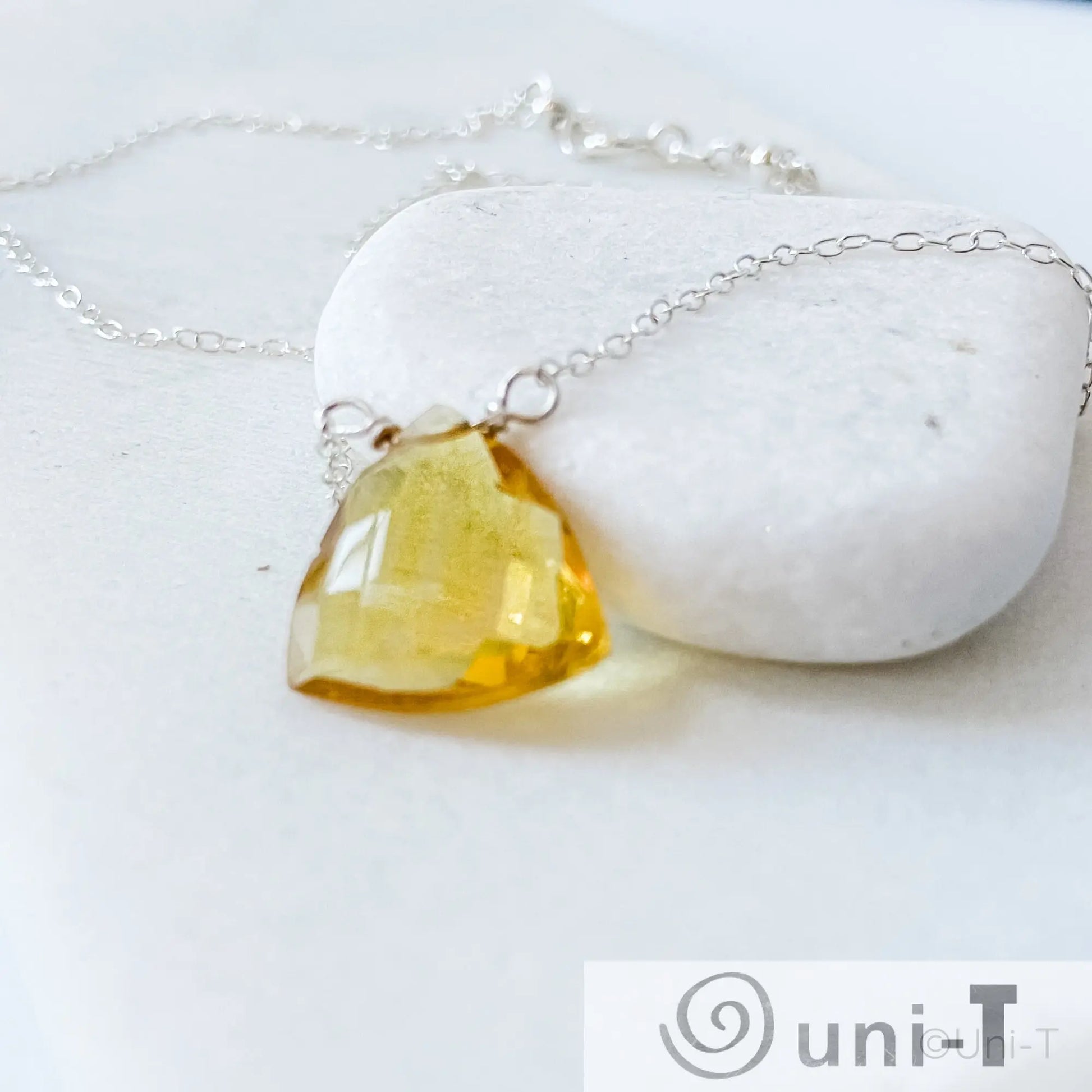 Angled view of Citrine Gemstone Necklace with genuine citrine pendant on fine silver chain, ideal for meaningful jewelry gifts.