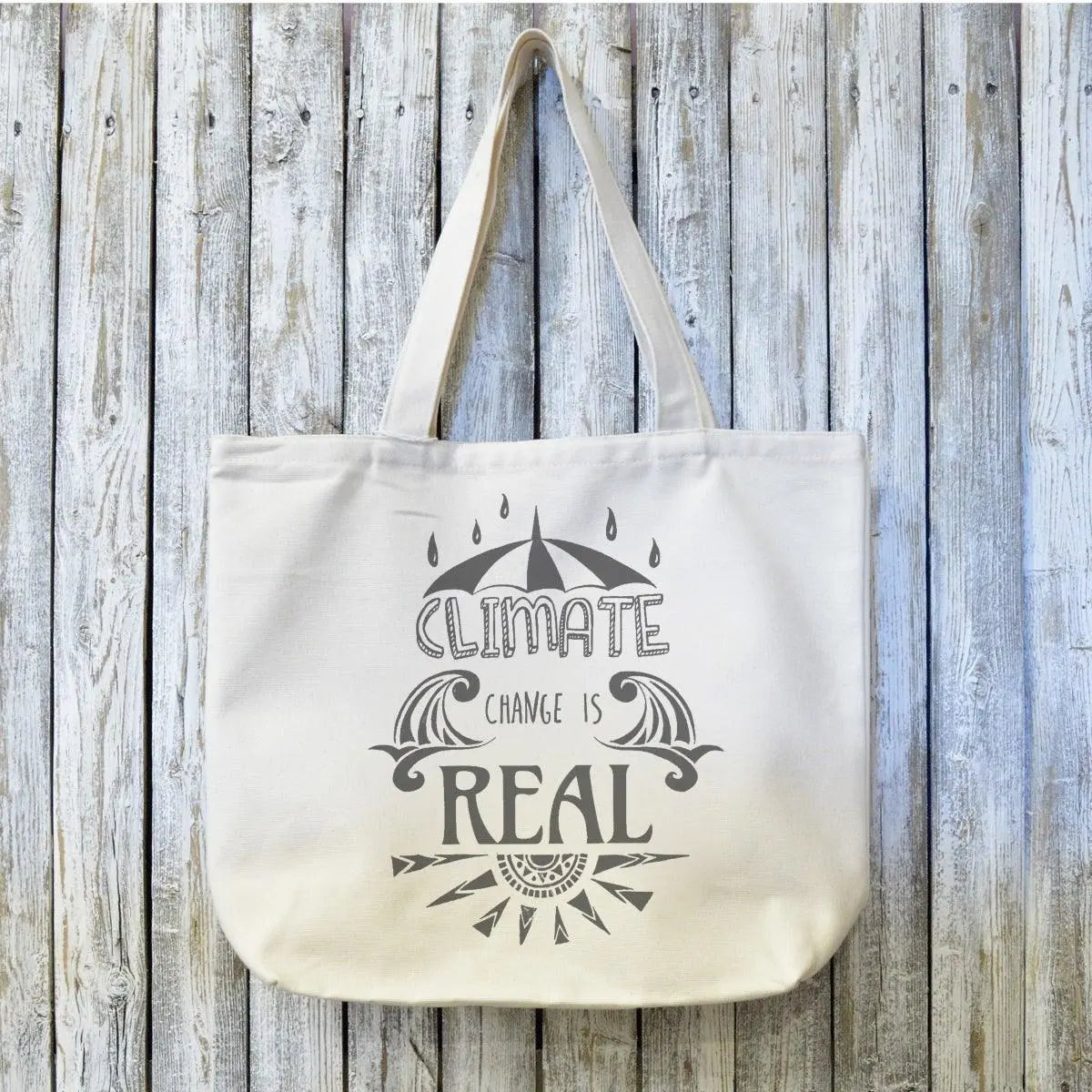 Organic canvas tote bag with 'Climate Change Is Real' artist design, ideal eco gift for climate activists. Durable and sustainable for everyday use.