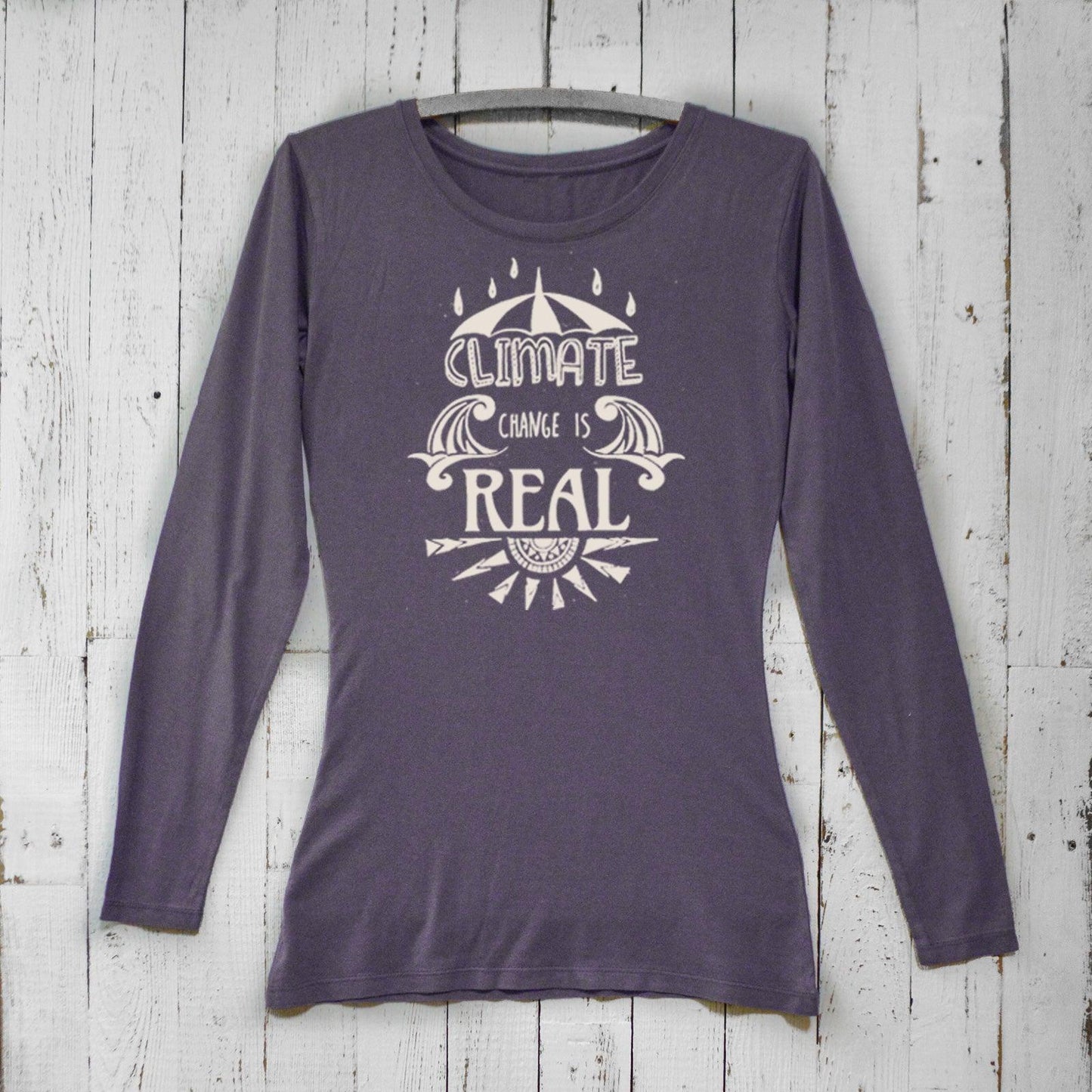 Women's Climate Change Long Sleeve T-Shirt in dark purple bamboo and organic cotton featuring bold 'Climate Change is Real' design. Sustainable gift idea.