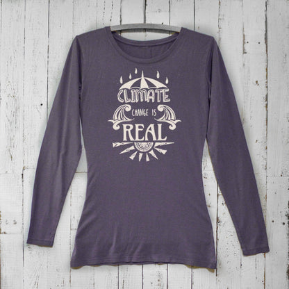 Women's Climate Change Long Sleeve T-Shirt in dark purple bamboo and organic cotton featuring bold 'Climate Change is Real' design. Sustainable gift idea.