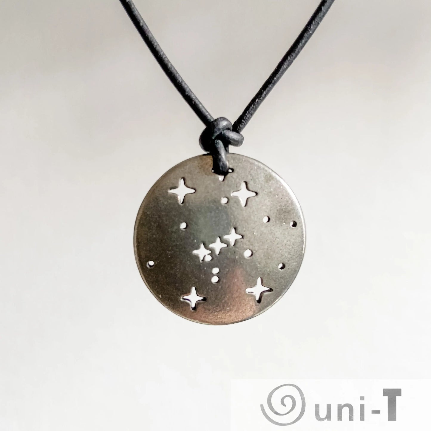 Orion Pendant - Orion Constellation Necklace in pewter with star cutouts on a black cord. Ideal astronomy jewelry for science lovers.