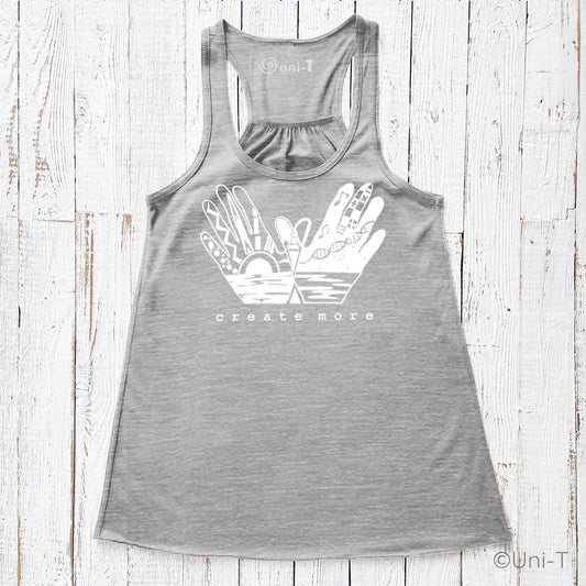 Gray 'Create More' flowy tank top for women featuring artistic hand graphic and sunrise design. Creative apparel for artists and makers.
