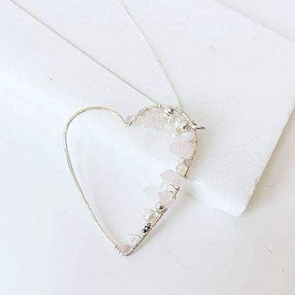 Artisan Crystal Heart Necklace with silver wire heart and gemstone accents. Sterling silver jewelry ideal for gifting or daily wear.