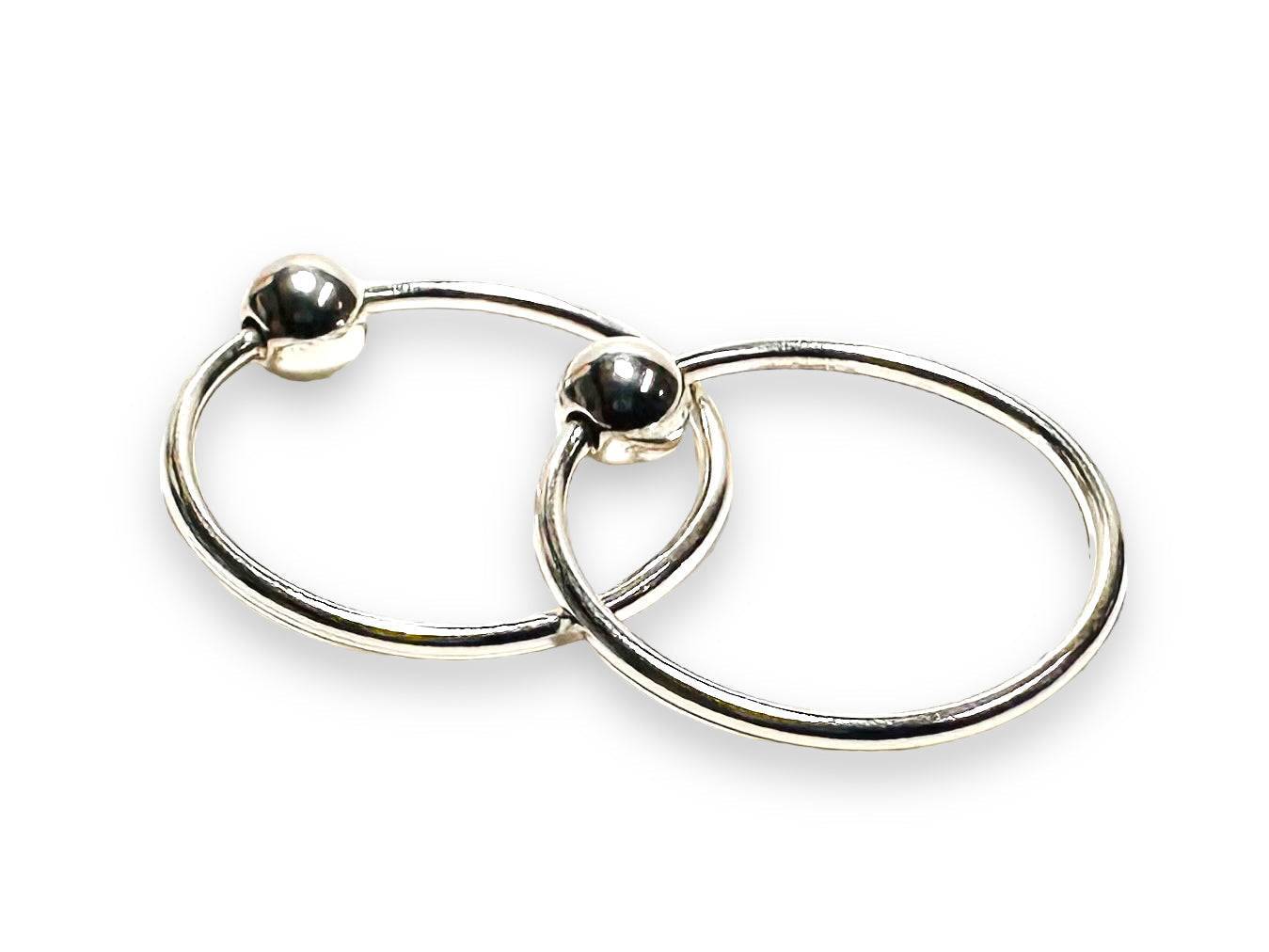 Silver Hoop Earrings 12MM - Perfect Everyday Wear, featuring a sleek polished finish with secure ball closure. Ideal for casual or formal outfits.