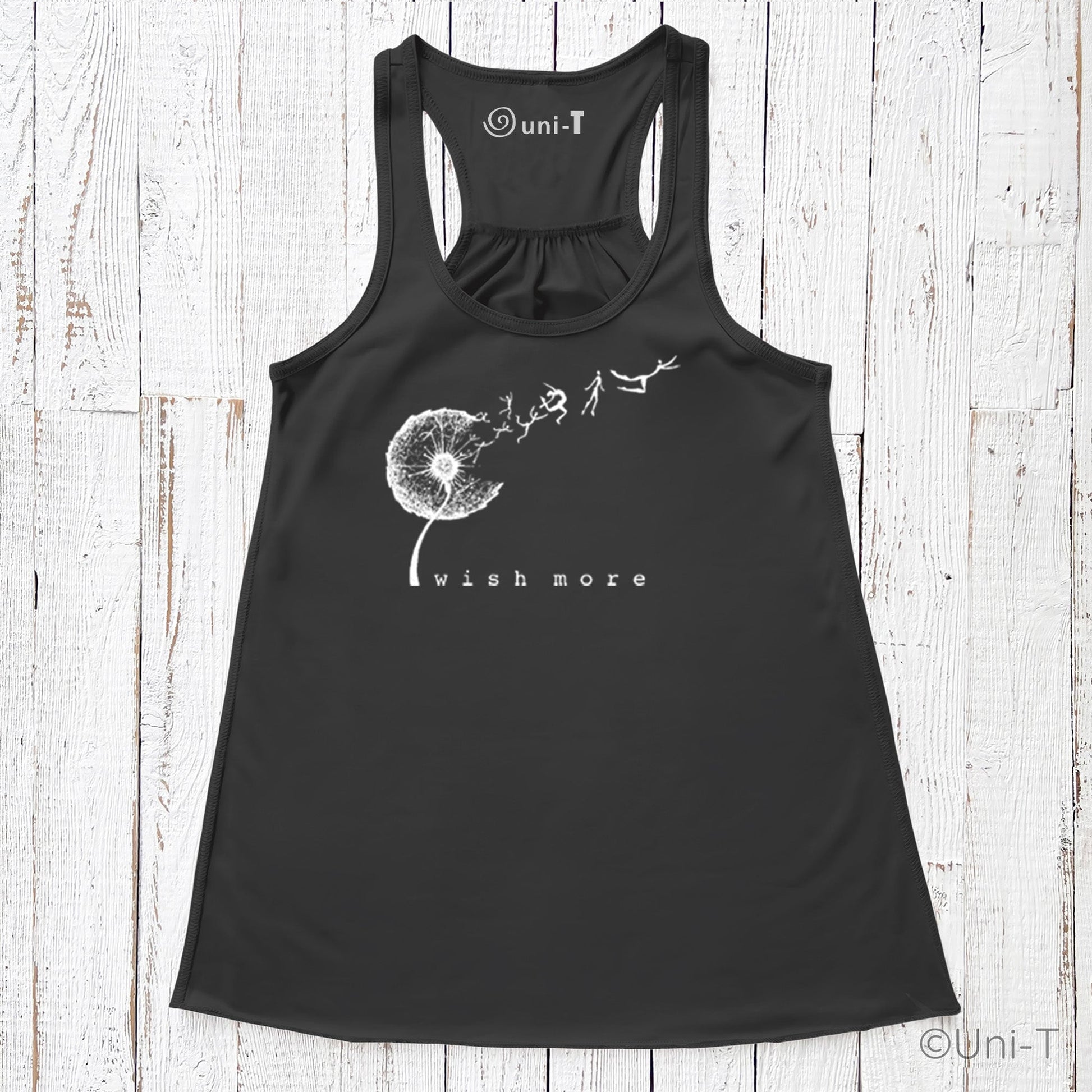 Black Wish More Flowy Tank Top with white dandelion and dreamer motif. Soft racerback style ideal for casual eco-conscious fashion.