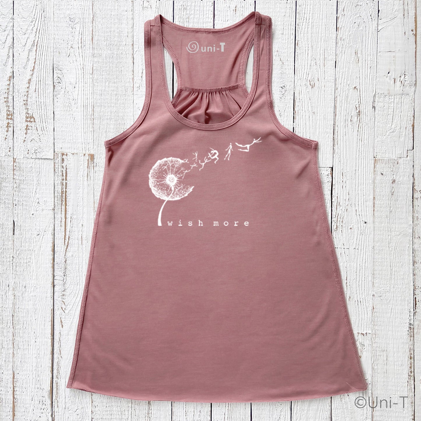 Dusty rose Wish More Flowy Tank Top with white dandelion and whimsical figures. Feminine racerback cut in soft, eco-friendly fabric.