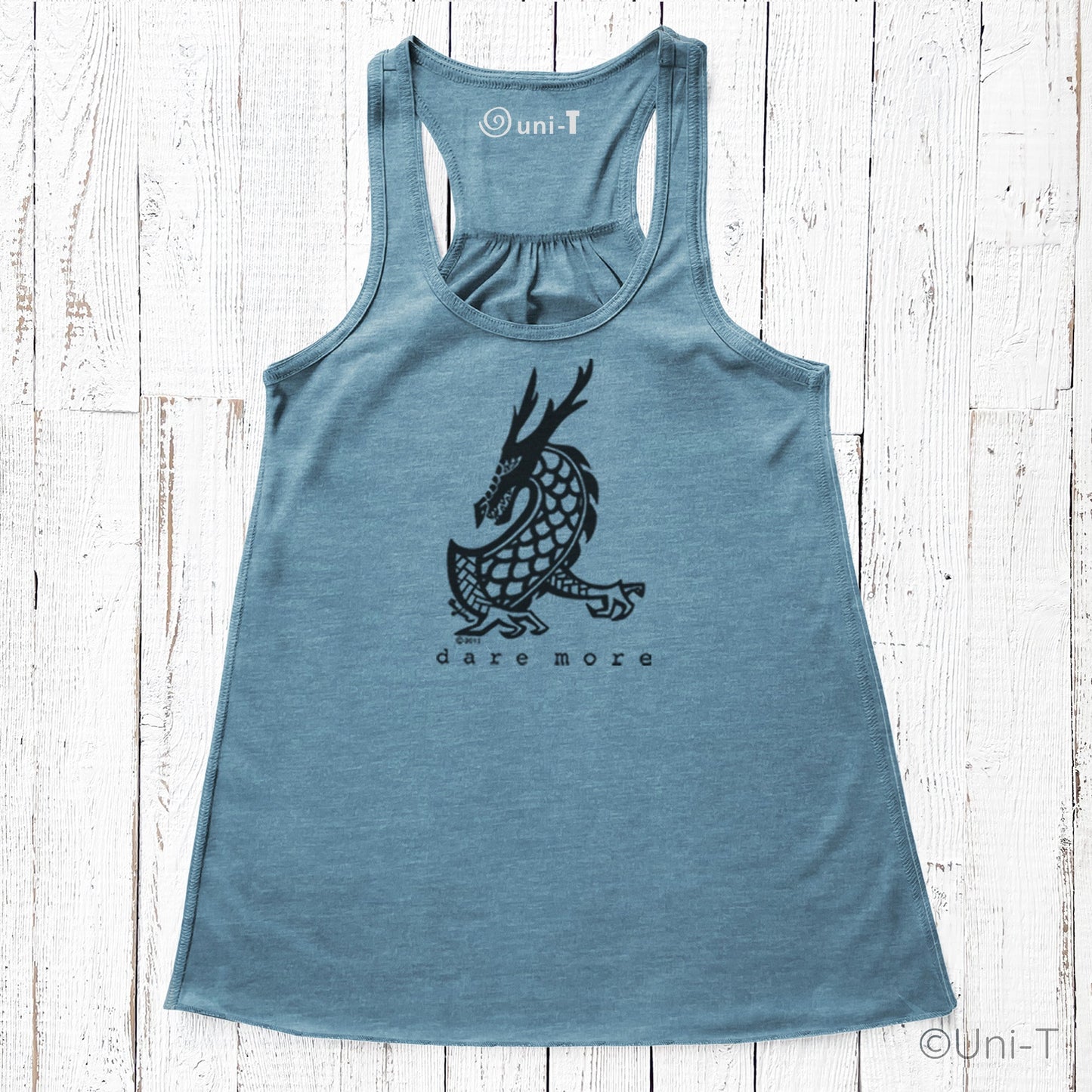 Blue Dragon Flowy Tank Top Women with black dragon print and 'dare more' slogan. Eco-friendly and perfect for active, courageous lifestyles.
