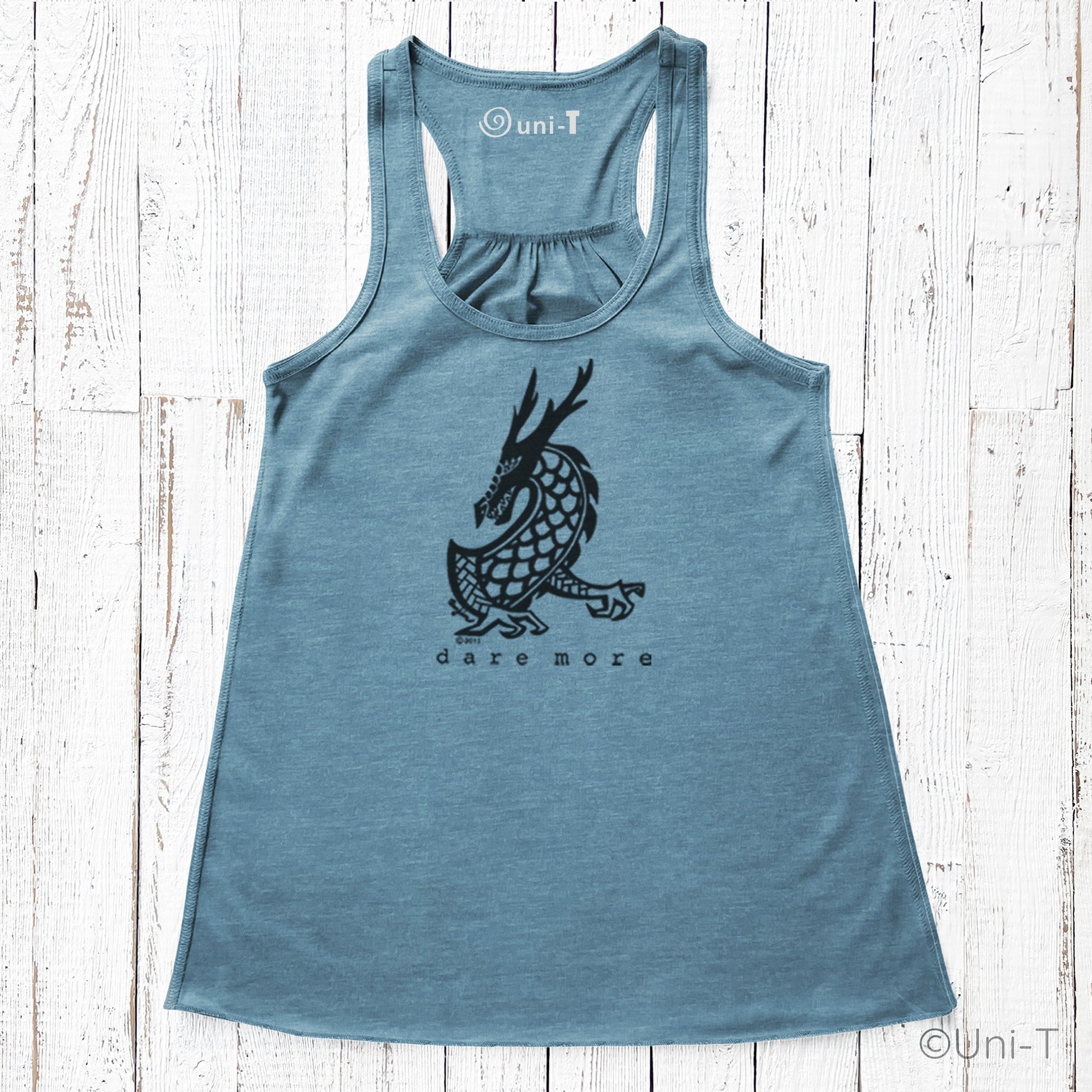Blue Dragon Flowy Tank Top Women with black dragon print and 'dare more' slogan. Eco-friendly and perfect for active, courageous lifestyles.