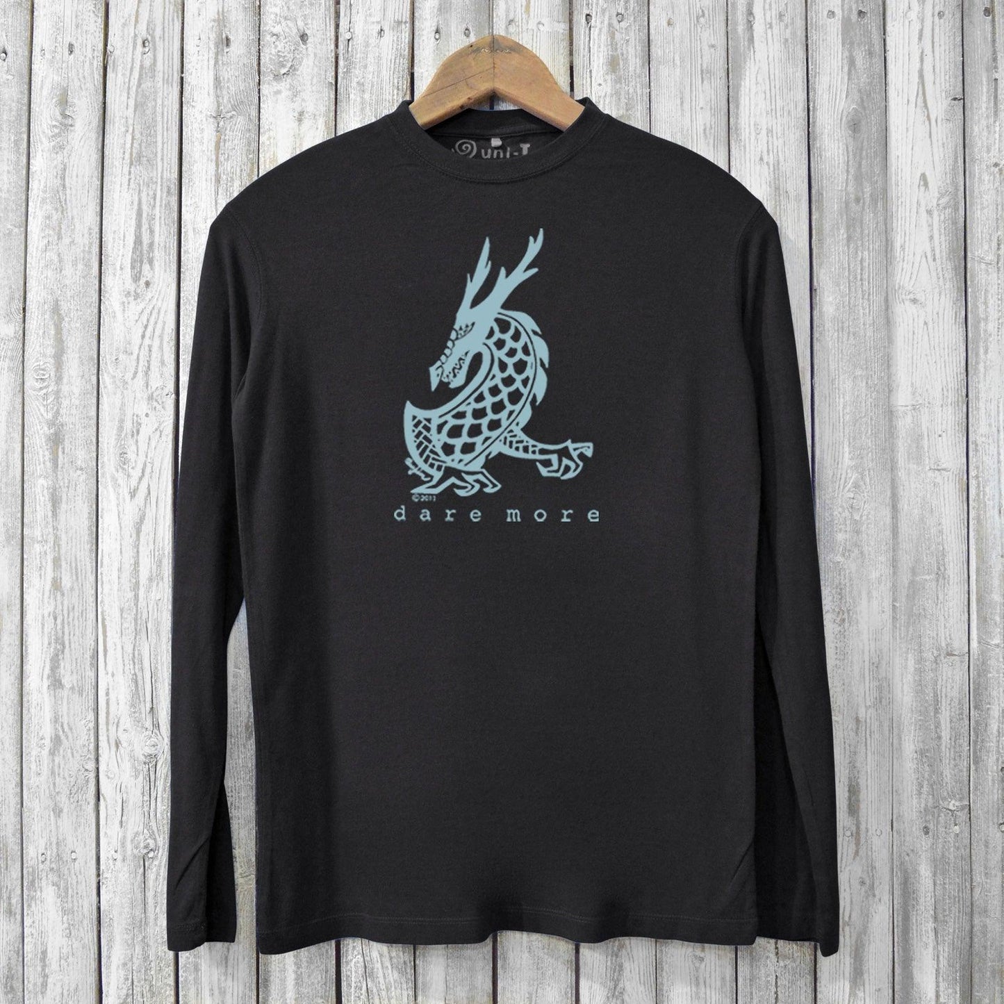 Black eco-friendly men's bamboo long sleeve t-shirt featuring a blue dragon graphic and 'dare more' text. Sustainable and breathable design.