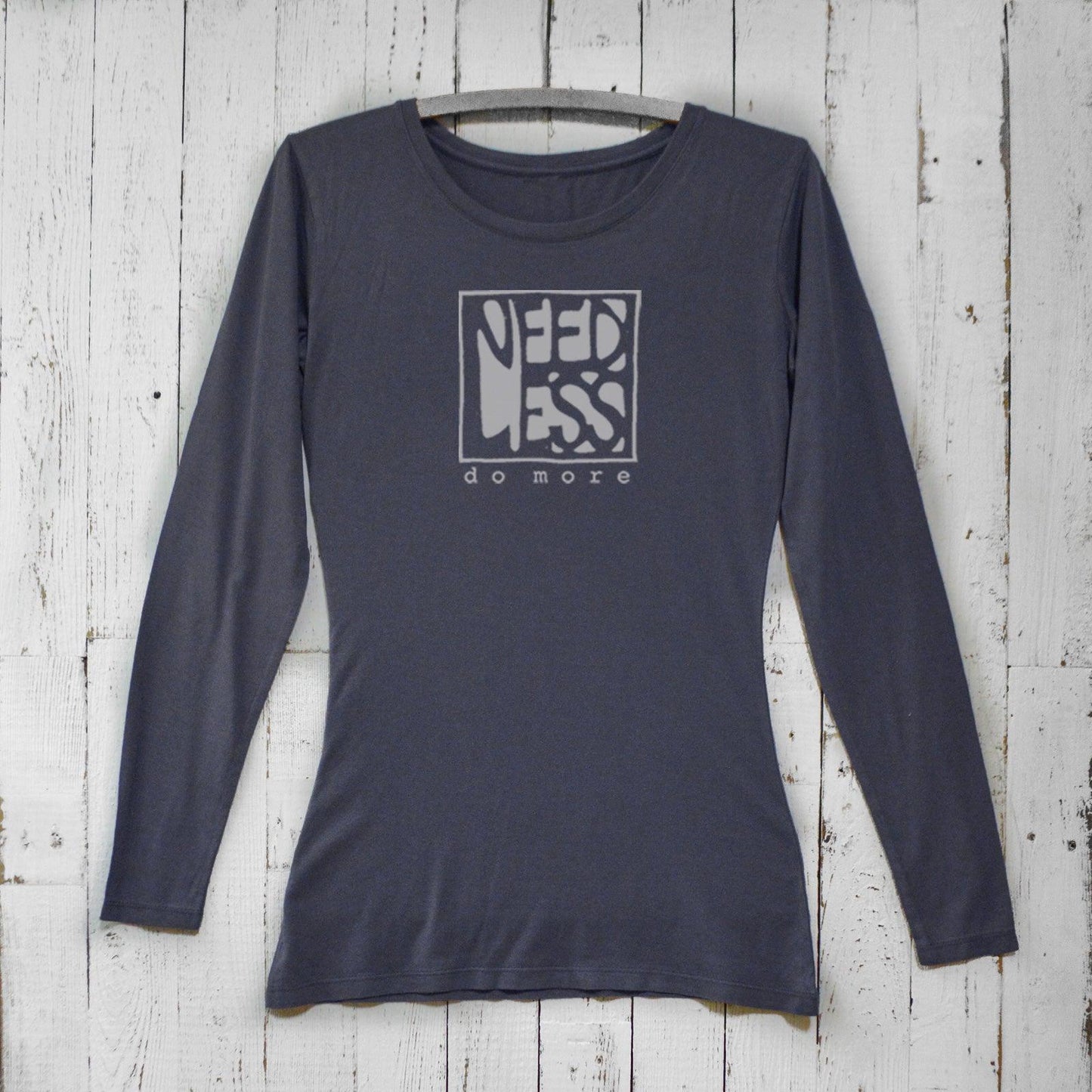 Women's minimalist long sleeve T-shirt in ocean blue bamboo and organic cotton with 'Need Less Do More' quote. Cozy lifestyle tee by Uni-T.