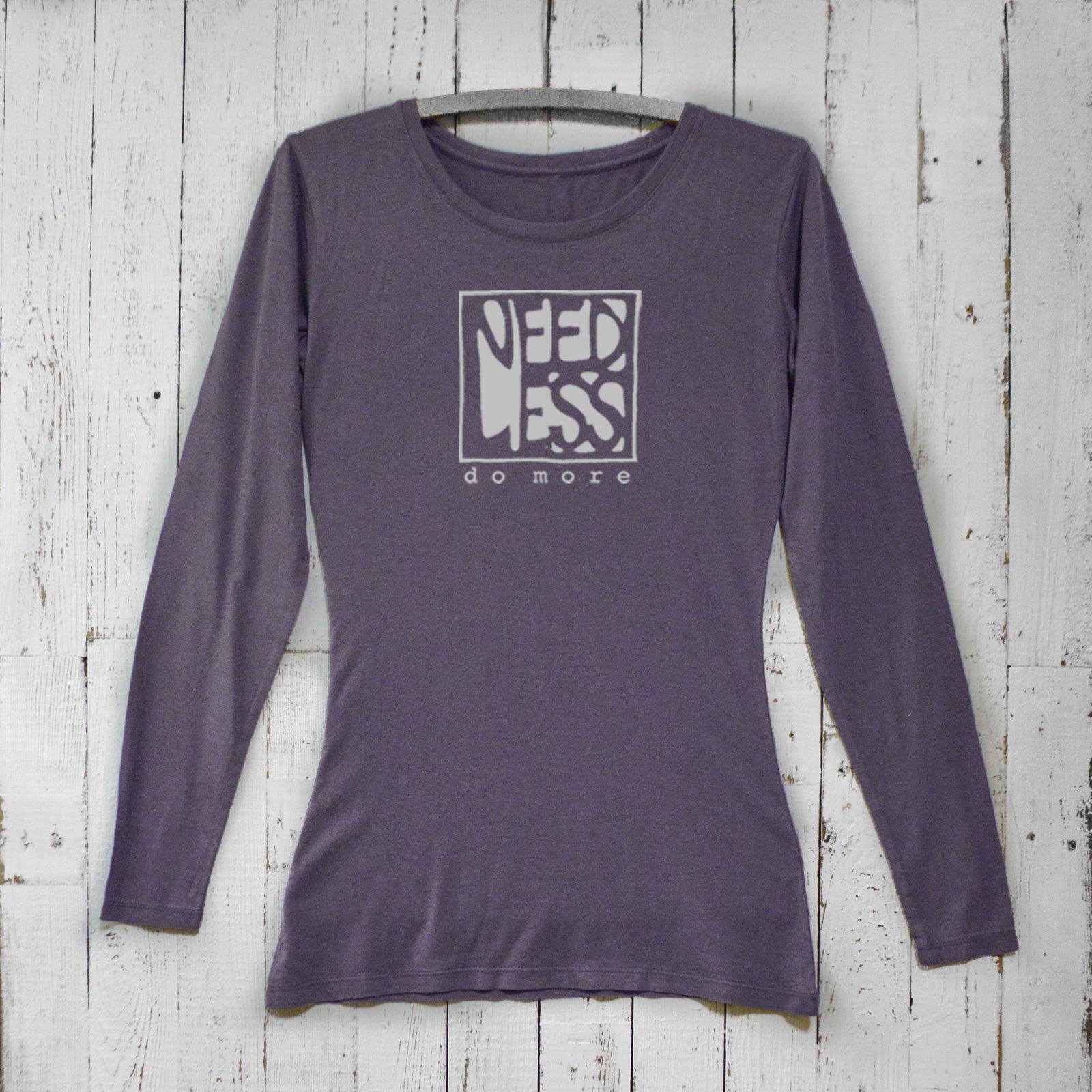 Dark purple women's bamboo and organic cotton long sleeve shirt with 'Need Less Do More' design. Eco-friendly minimalist apparel by Uni-T.