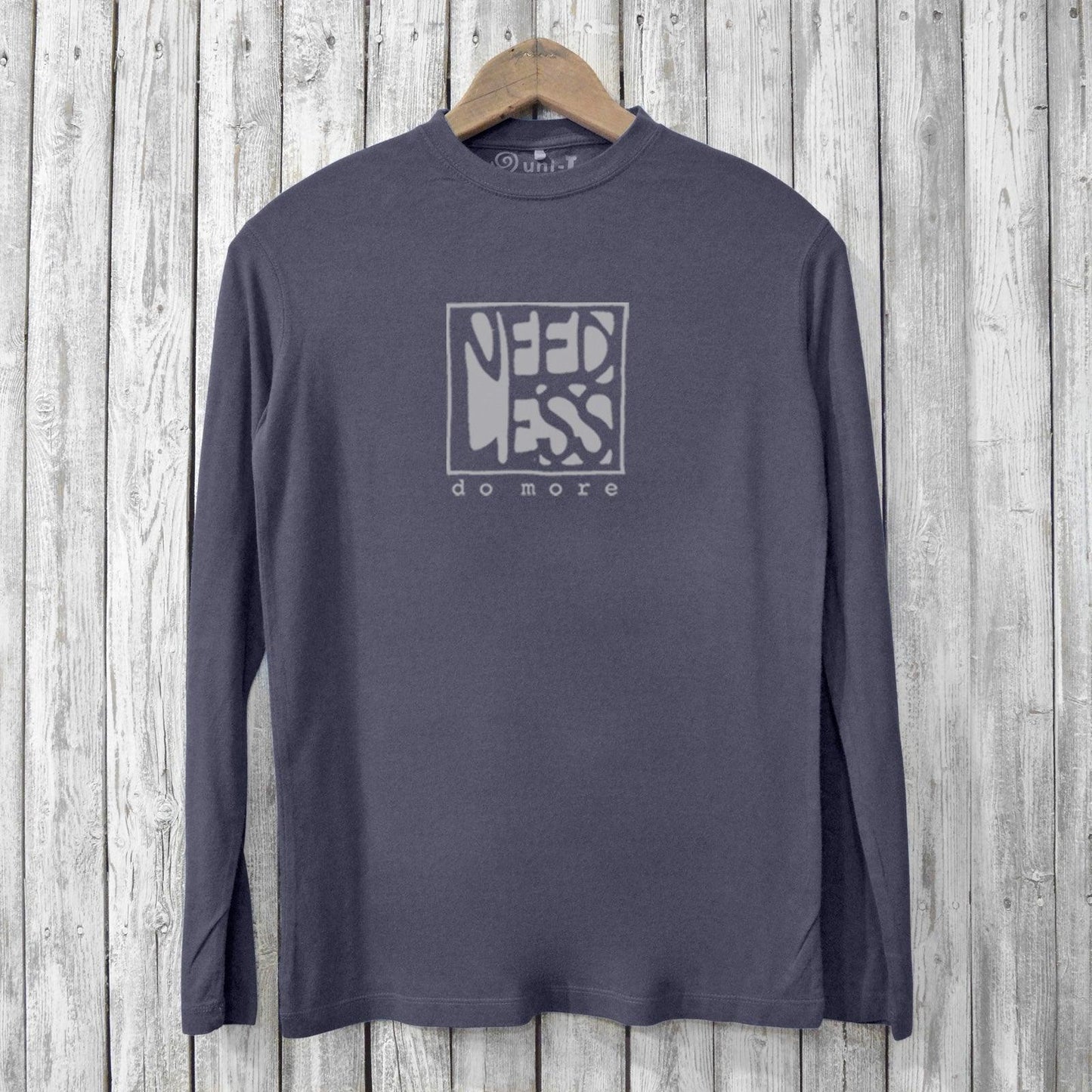 Men's bamboo long sleeve t-shirt in charcoal gray with 'Need Less Do More' graphic. Eco-friendly and sustainable style for casual wear.