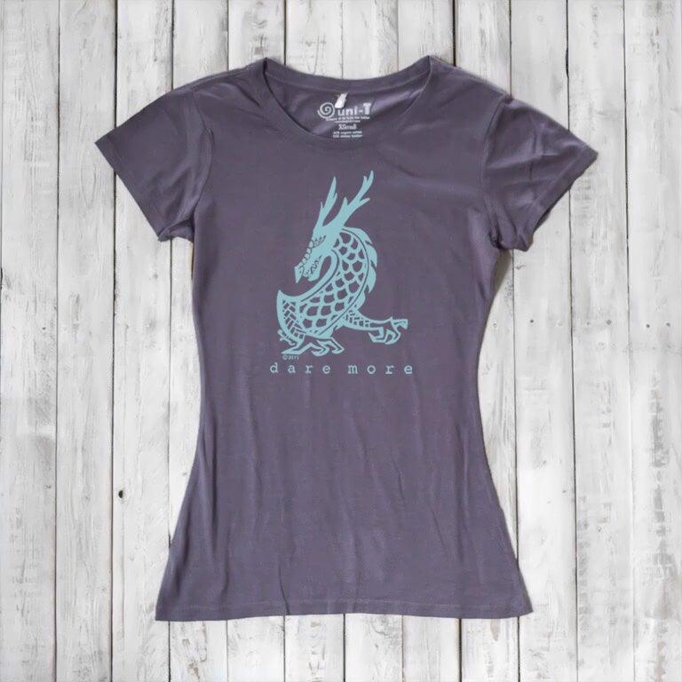 Charcoal grey 'Dare More' women's T-shirt with light blue dragon design. Bamboo-organic cotton fantasy tee by Uni-T.