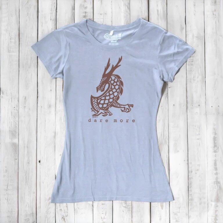 Light blue 'Dare More' women's T-shirt with brown dragon design. Sustainable bamboo-organic cotton graphic tee by Uni-T.