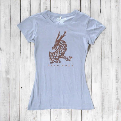 Light blue 'Dare More' women's T-shirt with brown dragon design. Sustainable bamboo-organic cotton graphic tee by Uni-T.