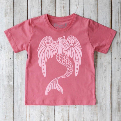 Pink Kids' Organic Cotton Mermaid Tee with light pink ocean-themed graphic. Eco-conscious Uni-T shirt featuring 'The Magnificent' mermaid artwork.