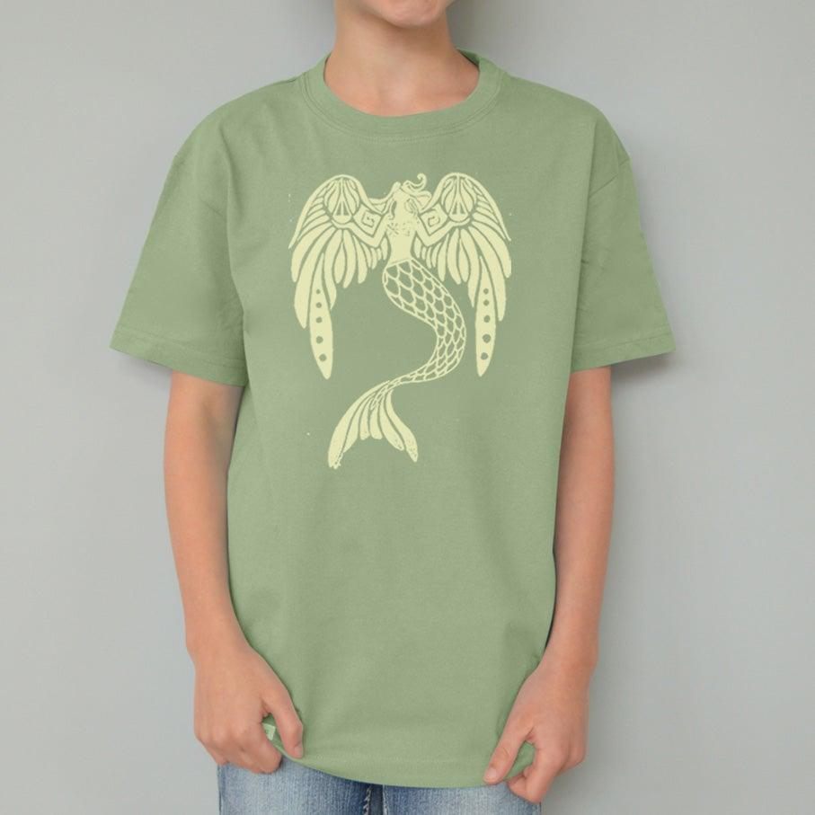 Child wearing green Kids' Organic Cotton Mermaid T-Shirt with yellow fantasy sea creature print. Sustainable Uni-T apparel, 'The Magnificent' design.