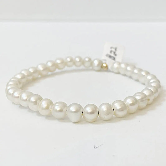 Freshwater pearl bracelet with large-hole pearls on stretch cord, ideal for elegant everyday wear or special occasions.