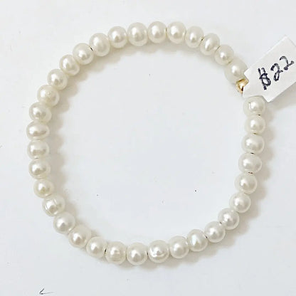 Round freshwater pearl bracelet on stretch cord with large-hole pearls, a timeless accessory for any jewelry collection.