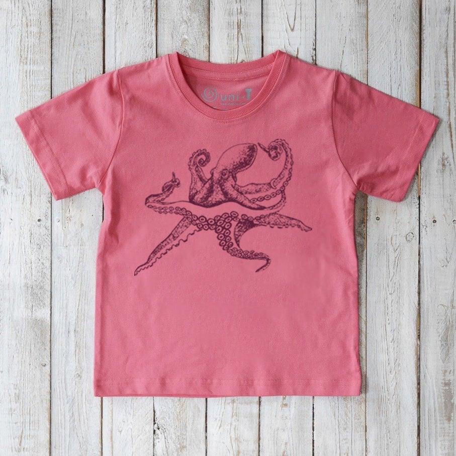 Pink Kids' Octopus Organic Cotton T-Shirt with dark purple ocean life graphic. Eco-friendly sea creature top by Uni-T for children.