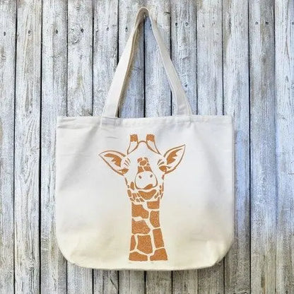 Giraffe Organic Tote Bag - Handmade Design featuring a smiling giraffe print on eco-friendly organic canvas. Durable and perfect for sustainable gifting.