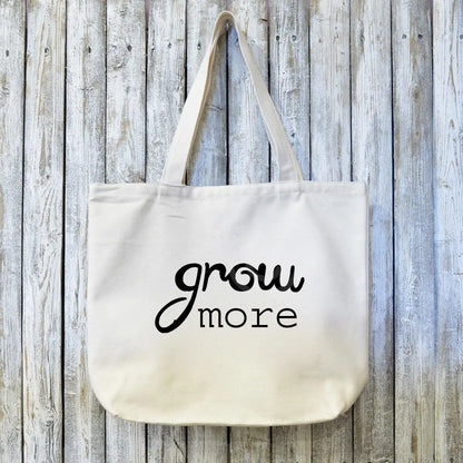 Gardening Gift Organic Tote Bag with 'grow more' text in black on eco-friendly canvas. Ideal sustainable gift for gardeners and nature lovers.