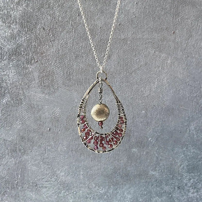 Garnet Necklace - Teardrop Pendant | 18" Sterling Silver featuring a handcrafted teardrop frame with red garnet beads and a brushed silver accent ball.