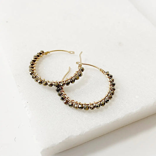 Sterling silver or gold filled hoop earrings featuring faceted pyrite gemstones, ideal for stylish and versatile accessory collections.