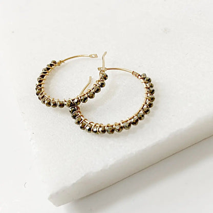 Handmade gemstone hoop earrings in gold fill with shimmering pyrite beads, perfect for gifting or enhancing any jewelry wardrobe.