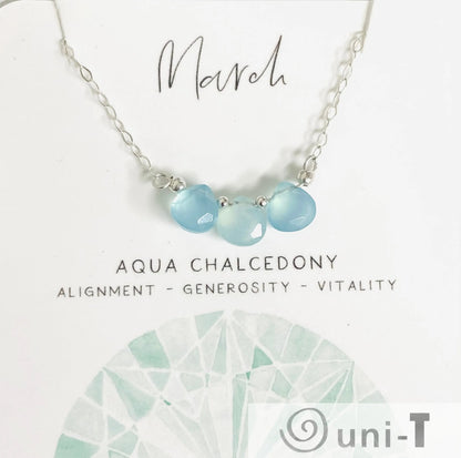 Aqua chalcedony gemstone necklace for March with sterling silver chain. Features three hand-cut stones symbolizing vitality and alignment.