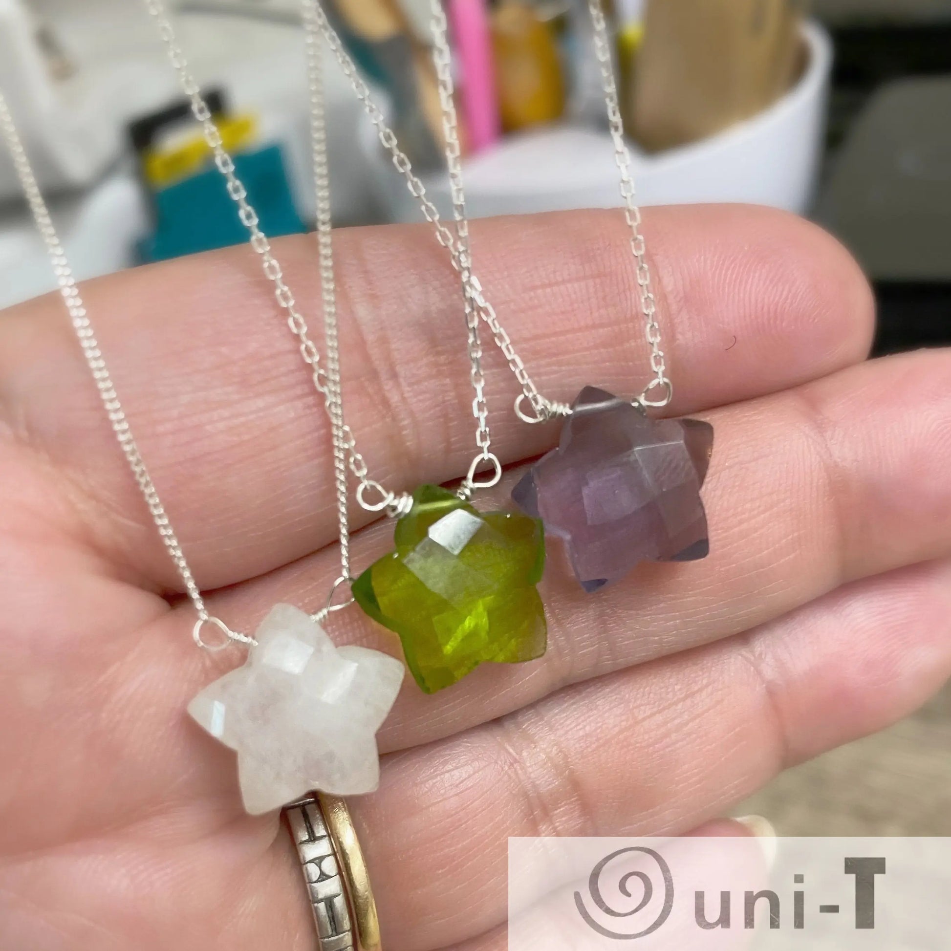 Gemstone Star Necklace - Buy Now | Genuine Gemstone Jewelry featuring hand-cut star-shaped beads in moonstone, peridot, and amethyst on sterling silver chains.