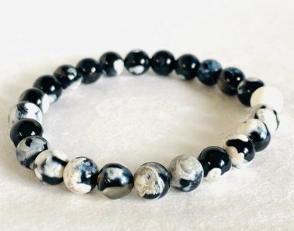 Black and white patterned gemstone stretch bracelet with swirling agate beads, perfect for monochrome fashion lovers.