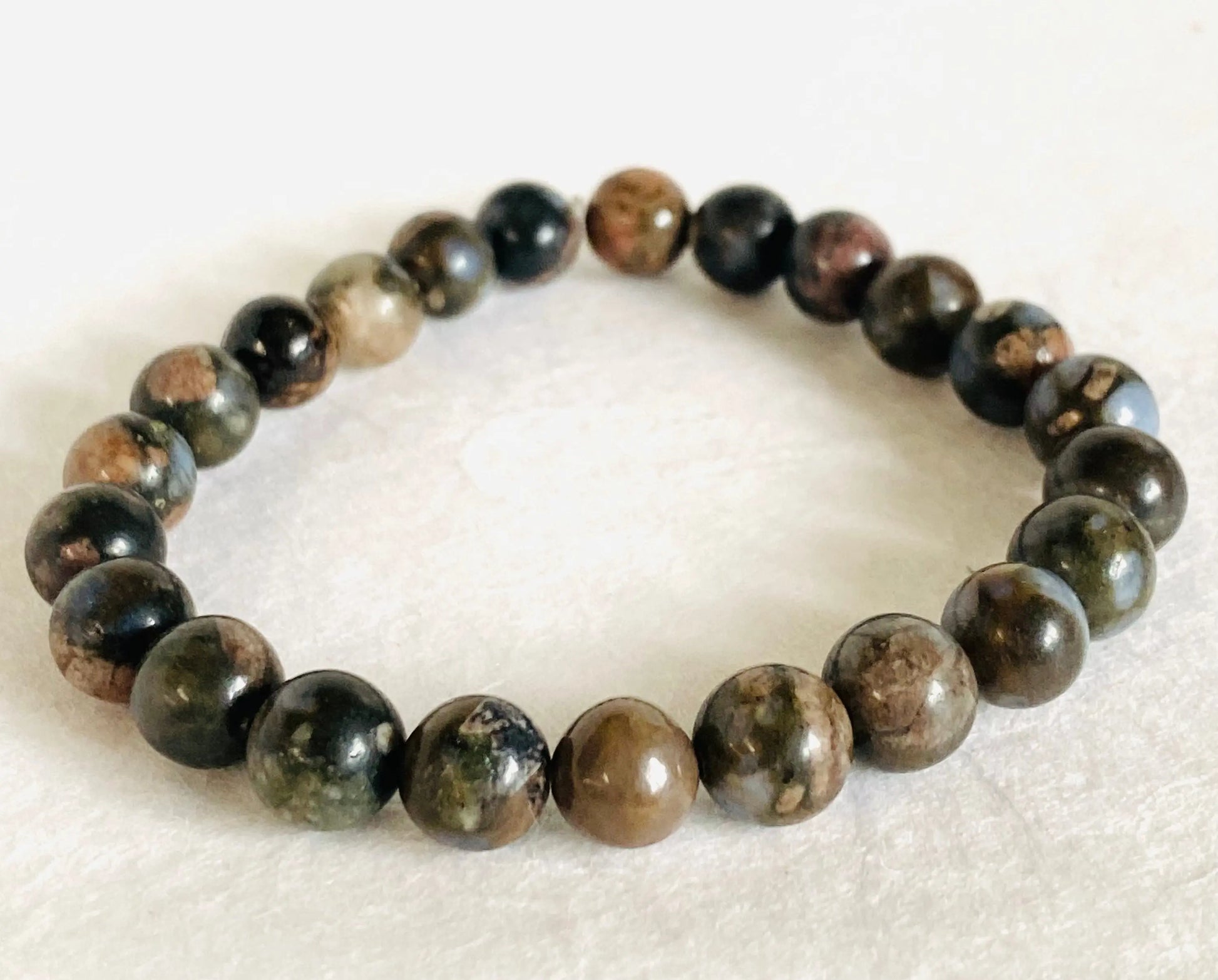 Dark-toned agate gemstone stretch bracelet with earthy hues, perfect for grounding and natural style lovers.