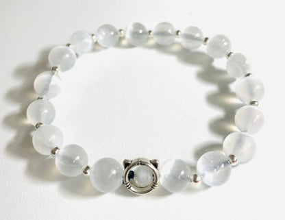White selenite gemstone stretch bracelet with silver accents, offering a clean, minimalist look for spiritual wear.