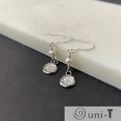 Glitter and Pearl Earrings - Pearl Earrings | Sterling Silver, Freshwater Pearls featuring glitter charms and pearls on sterling silver hooks, displayed on a white marble slab.