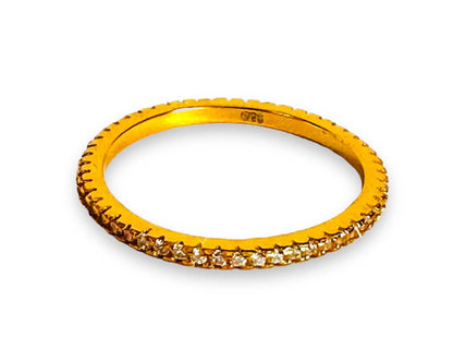 Single gold filled stacking ring with a full band of cubic zirconias, ideal for dainty and minimalist jewelry collections.