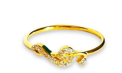 Gold filled dainty ring with a music note-inspired cubic zirconia design, perfect for stacking or wearing solo.