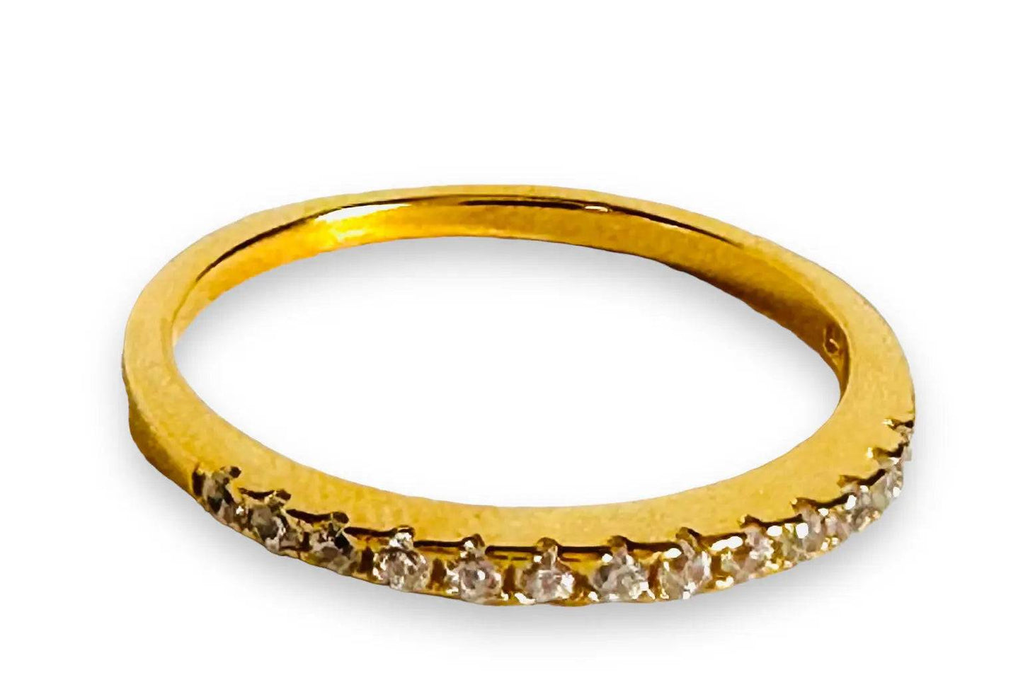 Minimalist gold filled stacking ring with a half-band of cubic zirconias, ideal for elegant everyday wear.