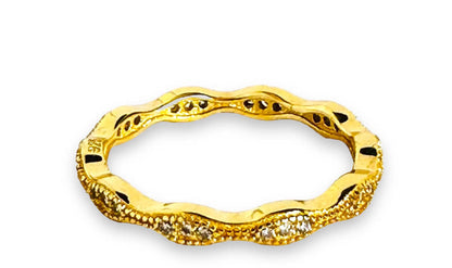 Wavy gold filled stacking ring with embedded cubic zirconias, offering a textured and stylish look for layering.
