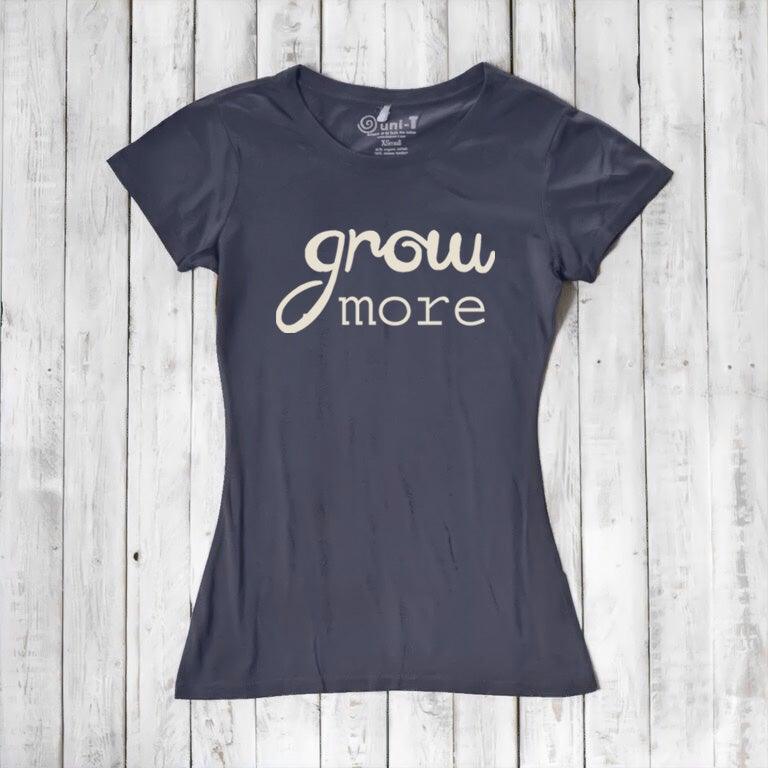 Navy blue bamboo and organic cotton T-shirt for women featuring 'Grow More' in cream. A soft, sustainable gift for plant lovers.