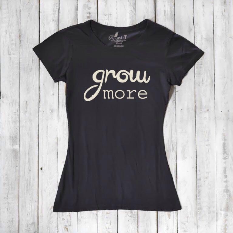 Black women's T-shirt with 'Grow More' quote in cream. Eco-friendly bamboo and organic cotton blend, perfect for gardening fans.