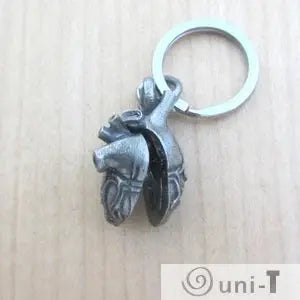 Anatomical Heart Keychain opens to reveal inner chambers and valves, a unique gift for anatomy lovers and science enthusiasts.