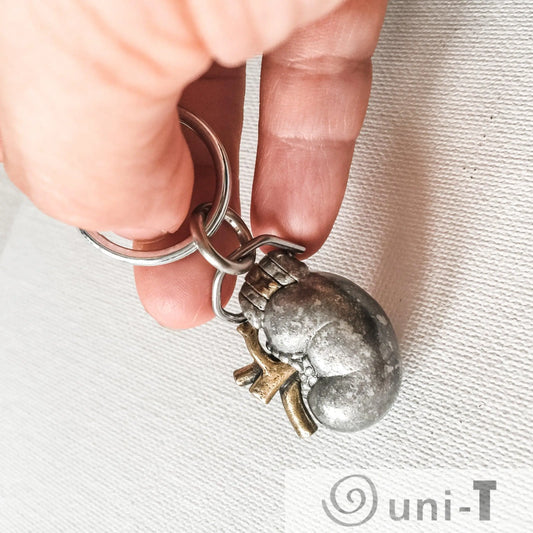 Close-up of Human Kidney Keychain - Anatomy Gift | Genuine Pewter held in hand, showcasing its realistic anatomical detail and durable metal craftsmanship.