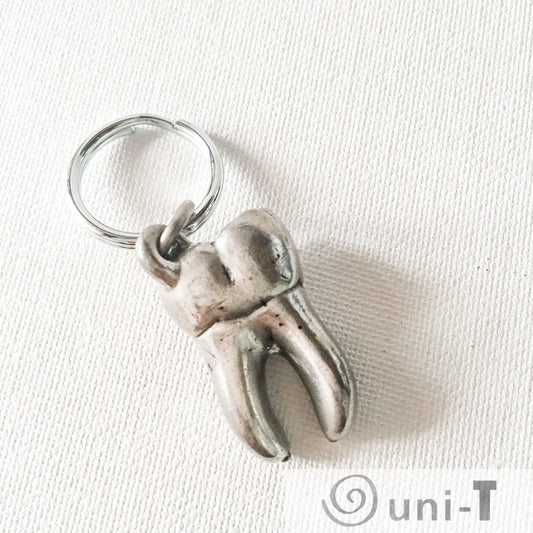 Back view of Human Tooth Keychain - Anatomical Human Molar Keychain in handcrafted pewter, perfect small gift for dental enthusiasts.