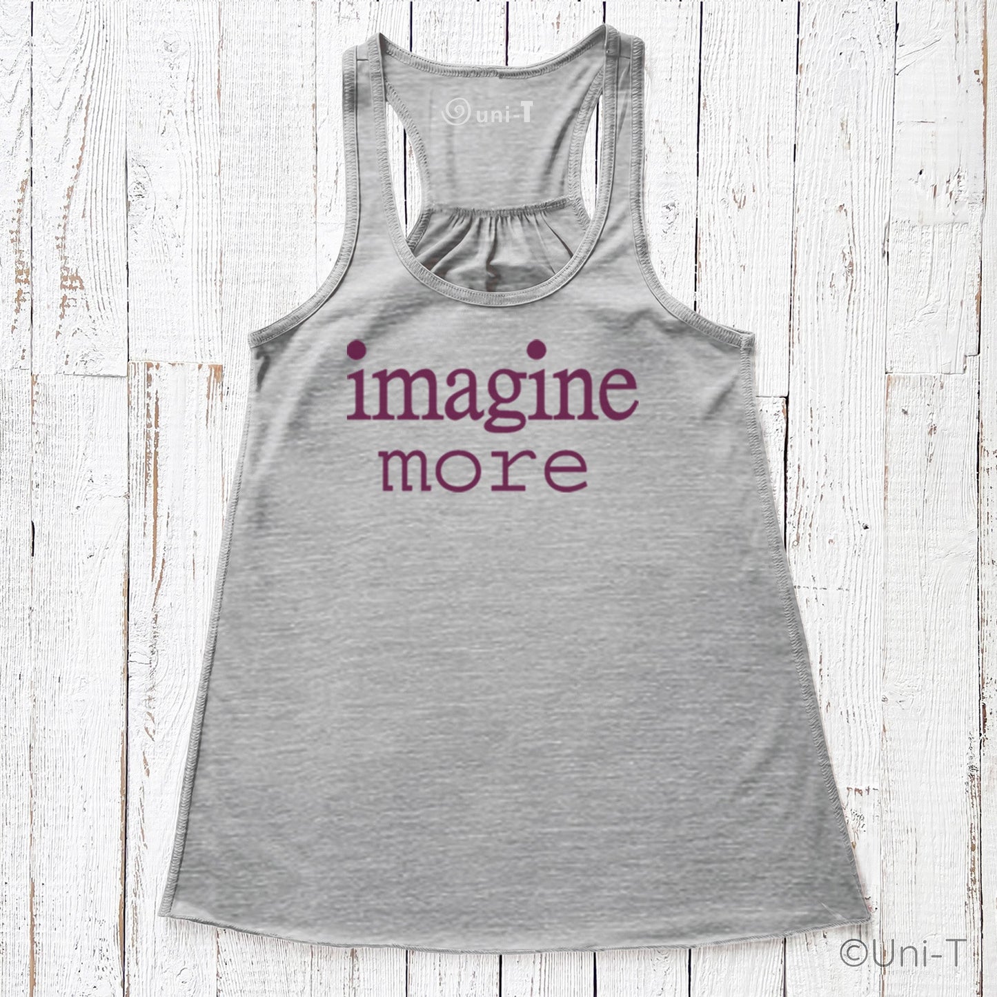 Women’s Flowy Tank Top - Imagine More in heather gray with purple text. Relaxed fit tank top made in the USA with sustainable materials.