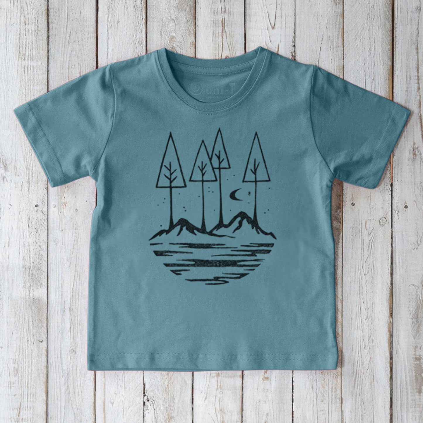 Soft blue Kids' Nature T-Shirt in 100% organic cotton, featuring a peaceful mountain and tree design, perfect for eco-conscious families.