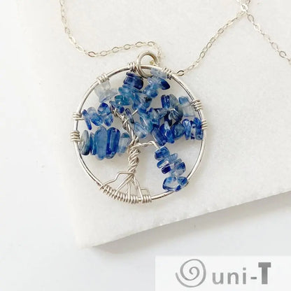 Close-up of Kyanite Tree of Life Necklace with sterling silver wire forming a tree shape adorned with polished blue kyanite chips.