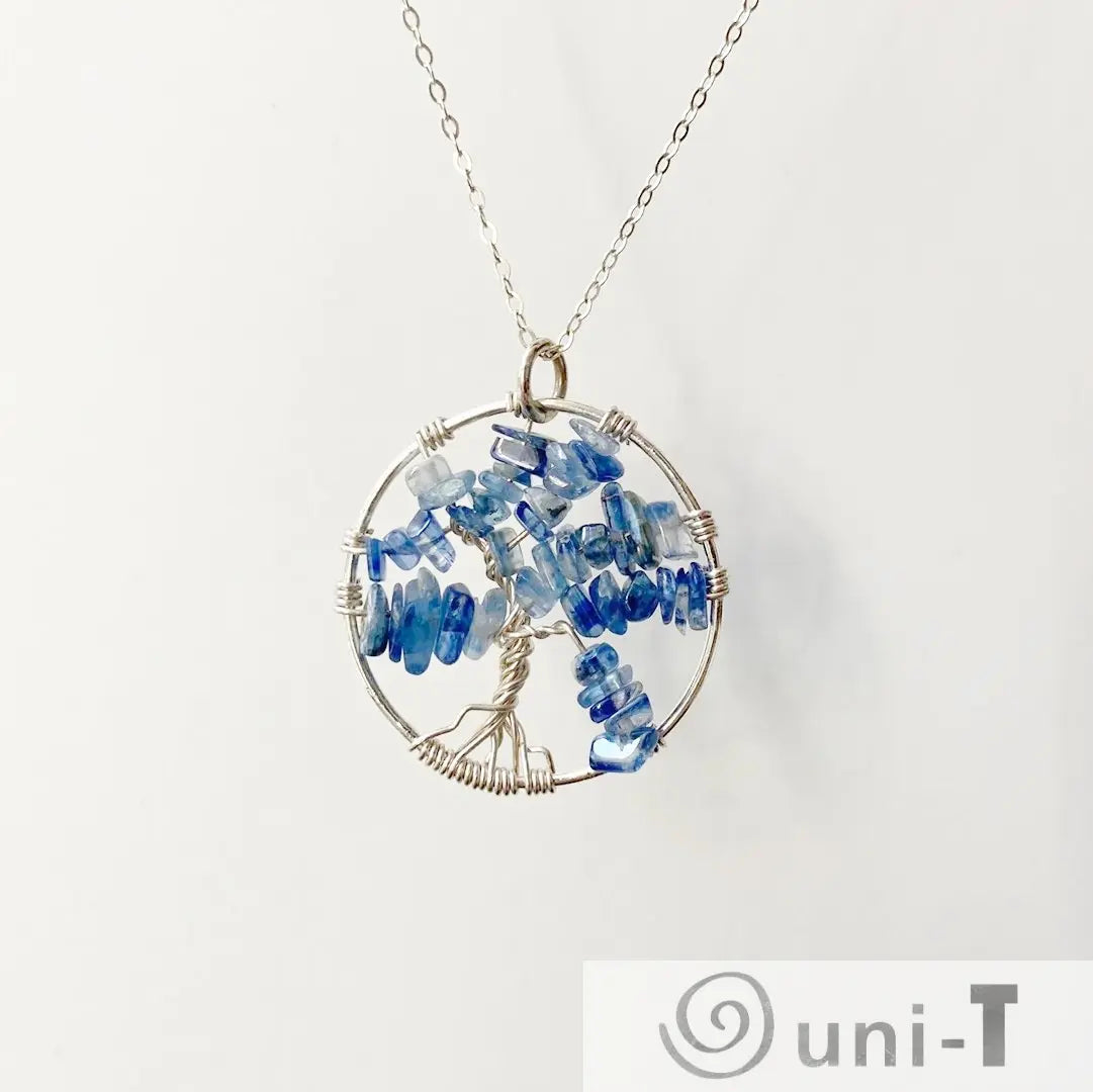 Sterling silver Kyanite Necklace with Tree of Life pendant, showcasing handcrafted wirework and vibrant blue kyanite stones.