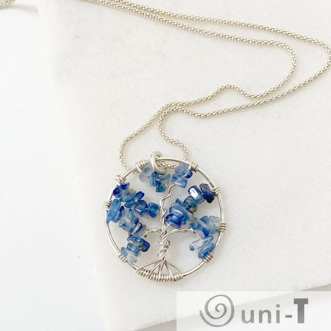 Elegant Tree of Life Sterling Silver Necklace with kyanite chip pendant, symbolizing spiritual growth and natural beauty.