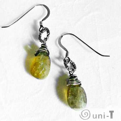 Antiqued silver labradorite earrings with faceted gemstone drops and textured wire wrapping, ideal for boho and artisan jewelry lovers.